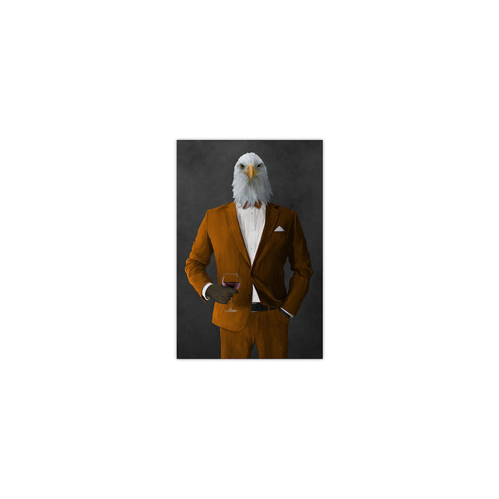 Bald eagle drinking red wine wearing orange suit small wall art print
